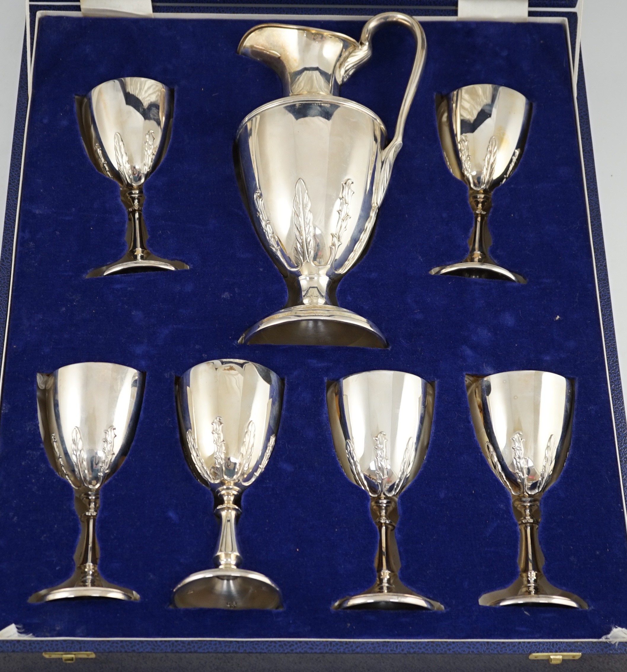 A modern cased silver ewer and six matching goblets by Courtman Silver Ltd